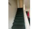 Carpeted staircase with a built-in storage cabinet, leading to the upper level of the home at 5417 Seabaugh Ave, Las Vegas, NV 89107