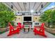 Backyard oasis with pergola, lounge chairs, fire pit, and outdoor entertainment center at 5553 Coral Gate St, Las Vegas, NV 89148