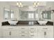 Elegant bathroom boasts double sinks, stylish lighting, and a marble shower at 5553 Coral Gate St, Las Vegas, NV 89148