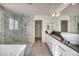 Bathroom featuring double sinks, walk-in shower, and large tub at 5553 Coral Gate St, Las Vegas, NV 89148