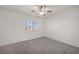 Bright bedroom with neutral walls, carpet and bright window with plantation shutters at 5553 Coral Gate St, Las Vegas, NV 89148