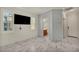 Bedroom with marble floors, two windows, and a view of the bathroom across the hall at 5553 Coral Gate St, Las Vegas, NV 89148