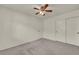 Neutral bedroom with plush carpet, ceiling fan, and convenient closet spaces at 5553 Coral Gate St, Las Vegas, NV 89148