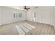 Bright bedroom featuring wood-look flooring, window with shutters and ceiling fan at 5553 Coral Gate St, Las Vegas, NV 89148