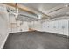 Spacious garage features epoxy flooring, overhead lighting, and ample storage cabinets at 5553 Coral Gate St, Las Vegas, NV 89148