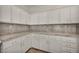 Kitchen with marble countertops, white cabinets, and stainless steel appliances at 5553 Coral Gate St, Las Vegas, NV 89148