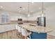 Bright, updated kitchen with a large island, white cabinets, and stainless steel appliances at 5553 Coral Gate St, Las Vegas, NV 89148