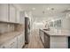Modern kitchen with stainless steel appliances, granite counters, and hardwood floors at 5553 Coral Gate St, Las Vegas, NV 89148