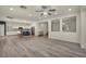 Open-concept living room and kitchen with hardwood floors and recessed lighting at 5553 Coral Gate St, Las Vegas, NV 89148
