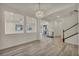 Open-concept living area featuring wood-look floors and bright lighting at 5553 Coral Gate St, Las Vegas, NV 89148