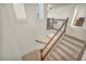 Carpeted staircase with wood railing leading to the upper level of the home at 5553 Coral Gate St, Las Vegas, NV 89148