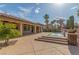 Expansive backyard with beautiful pool, patio, and lush landscaping with palm trees on a sunny day at 5576 Buena Martina Way, Las Vegas, NV 89141