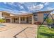 Backyard featuring a covered patio, artificial grass and a refreshing pool, perfect for outdoor enjoyment at 5576 Buena Martina Way, Las Vegas, NV 89141