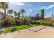 Backyard oasis with a play area, lush landscaping, and privacy fencing at 5576 Buena Martina Way, Las Vegas, NV 89141