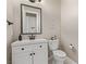 Bathroom featuring a vanity, toilet, decorative mirror, and clean, neutral decor at 5576 Buena Martina Way, Las Vegas, NV 89141