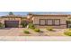 Single-story home featuring desert landscaping, brick accents, and a two-car garage at 5576 Buena Martina Way, Las Vegas, NV 89141