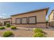 Single-story house featuring stone facade and decorative grid windows at 5576 Buena Martina Way, Las Vegas, NV 89141