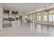 Open concept kitchen with stainless steel appliances and exposed brick accents at 5576 Buena Martina Way, Las Vegas, NV 89141