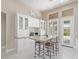 Kitchen nook featuring built-in cabinets and a marble-top breakfast bar at 5576 Buena Martina Way, Las Vegas, NV 89141