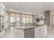 Kitchen island with granite countertops and stainless steel appliances at 5576 Buena Martina Way, Las Vegas, NV 89141