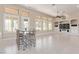 Open concept living room with breakfast bar and a view of the backyard at 5576 Buena Martina Way, Las Vegas, NV 89141