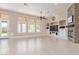 Living room features natural light, built-in entertainment center, and fireplace at 5576 Buena Martina Way, Las Vegas, NV 89141