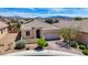 Residential home with tile roof, desert landscaping, and mountain views in a suburban neighborhood at 589 Via Paladini, Henderson, NV 89011