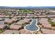 An aerial view of a Nevada neighborhood showcases the uniformity of single-Gathering homes with tile roofs at 589 Via Paladini, Henderson, NV 89011