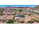 Desert community aerial view features modern single-Gathering homes with tile roofs near the mountains of Nevada at 589 Via Paladini, Henderson, NV 89011
