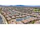 A neighborhood in Nevada offers a uniform look for single-Gathering homes with tile roofs and desert landscaping at 589 Via Paladini, Henderson, NV 89011