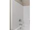 White tiled shower and tub combo at 589 Via Paladini, Henderson, NV 89011