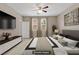 A virtually staged bedroom showcases a bed, contemporary art, and a tranquil aesthetic at 589 Via Paladini, Henderson, NV 89011