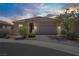 Charming single-story home featuring a two-car garage and well-manicured landscaping at 589 Via Paladini, Henderson, NV 89011