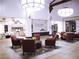 Inviting residential village lobby with tile flooring, comfortable seating, and bright lighting at 589 Via Paladini, Henderson, NV 89011