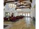 Beautiful lobby featuring tile flooring, wood beam construction, with pendant lighting at 589 Via Paladini, Henderson, NV 89011