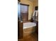 Bathroom with soaking tub and a window, which provides natural light and an attractive tile surround at 5941 Alington Bend Dr, Las Vegas, NV 89139