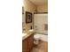 Neutral bathroom featuring tile floors, a shower with glass doors, and a granite vanity at 5941 Alington Bend Dr, Las Vegas, NV 89139