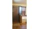 Bathroom featuring a glass shower, a bathtub, and a window for natural light at 5941 Alington Bend Dr, Las Vegas, NV 89139
