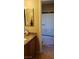 Bathroom featuring a tub and shower with a granite countertop and decorative mirror at 5941 Alington Bend Dr, Las Vegas, NV 89139