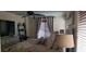 Bright bedroom with contemporary decor, including a ceiling fan, art, and shelving at 5941 Alington Bend Dr, Las Vegas, NV 89139