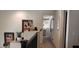 Hallway with views to open rooms filled with decor and natural light at 5941 Alington Bend Dr, Las Vegas, NV 89139