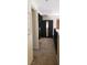 Hallway features neutral carpeting, a full length mirror, and a railing overlooking the first level at 5941 Alington Bend Dr, Las Vegas, NV 89139