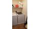 Bright laundry room featuring modern washer and dryer with tile floors at 5941 Alington Bend Dr, Las Vegas, NV 89139