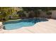 Inviting pool surrounded by mature trees, green landscaping, and concrete decking at 5941 Alington Bend Dr, Las Vegas, NV 89139