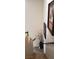 Carpeted stairway showcasing art and an ornamental plant to accent the home's interior at 5941 Alington Bend Dr, Las Vegas, NV 89139