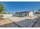 A backyard featuring a pool and a large covered patio at 6309 Miraloma St, Las Vegas, NV 89108
