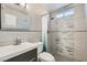 Modern bathroom featuring tiled shower, new fixtures, and a stylish mirror at 6309 Miraloma St, Las Vegas, NV 89108