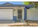Close up of the front entrance showcasing the storm door, brick accents, and covered entryway at 6309 Miraloma St, Las Vegas, NV 89108