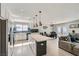 Open-concept kitchen boasts a large island, stainless appliances, and seamless flow to the living and dining areas at 6309 Miraloma St, Las Vegas, NV 89108
