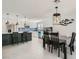 Spacious kitchen and dining area with tile floors, breakfast bar, and stainless steel appliances at 6309 Miraloma St, Las Vegas, NV 89108